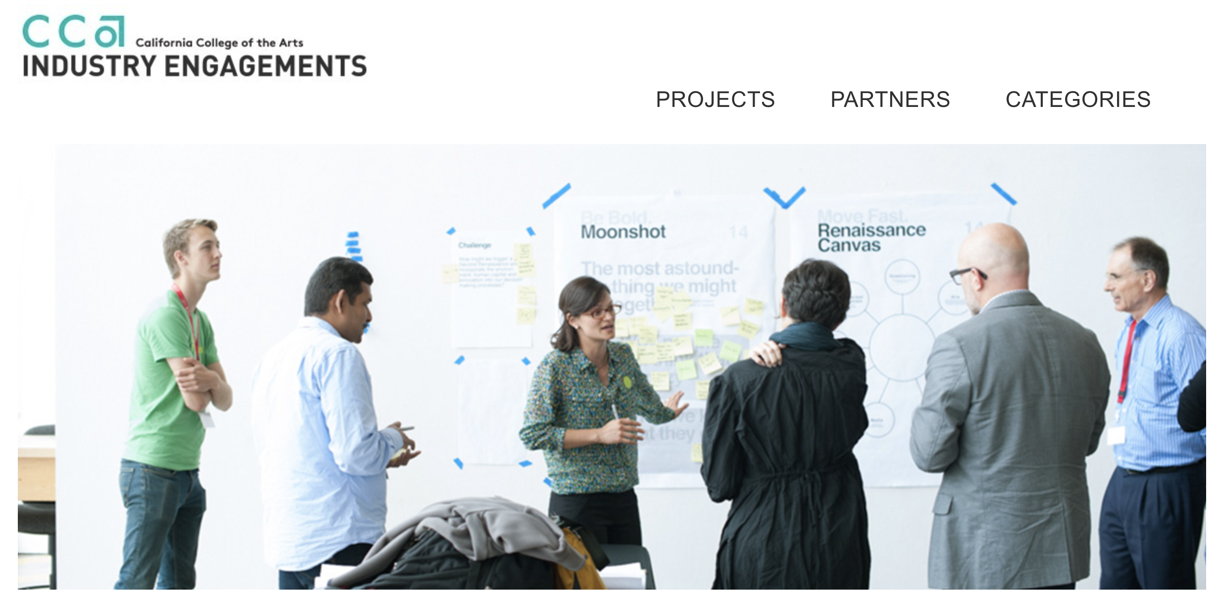 CCA's logo and the text 'Industry Engagements' sits above a picture of several people discussing in front of whiteboards with notes on them